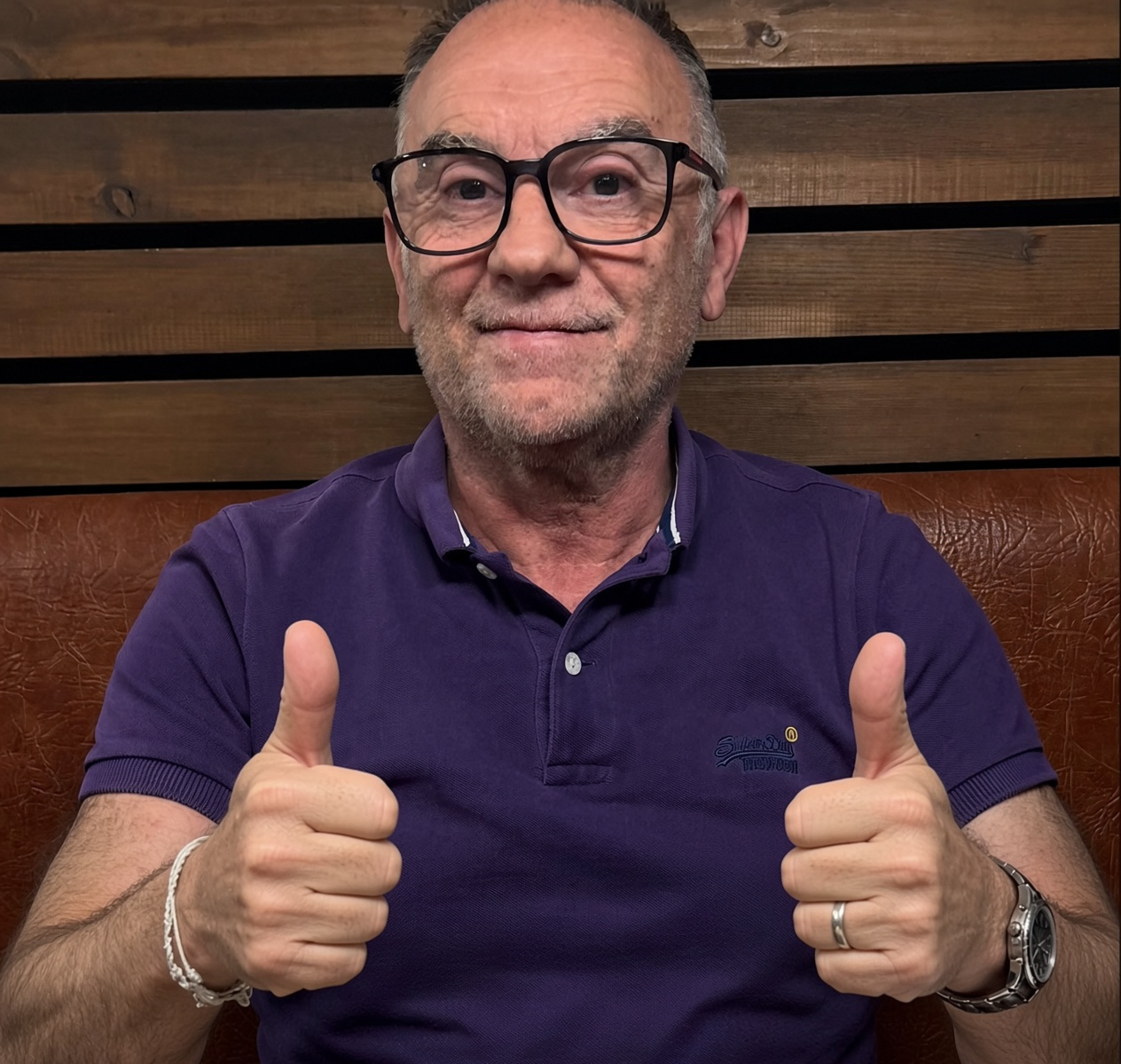 David Robert Harrison wearing a purple polo shirt